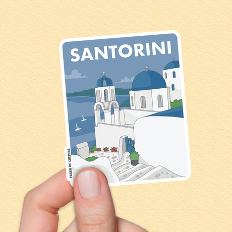 A high-quality vinyl sticker of the Greek Island of Santorini with the houses on a hill looking down over boats in the blue sea. The word Santorini is in large words across the top of the sticker—a lovely sticker souvenir of the Greek Islands.