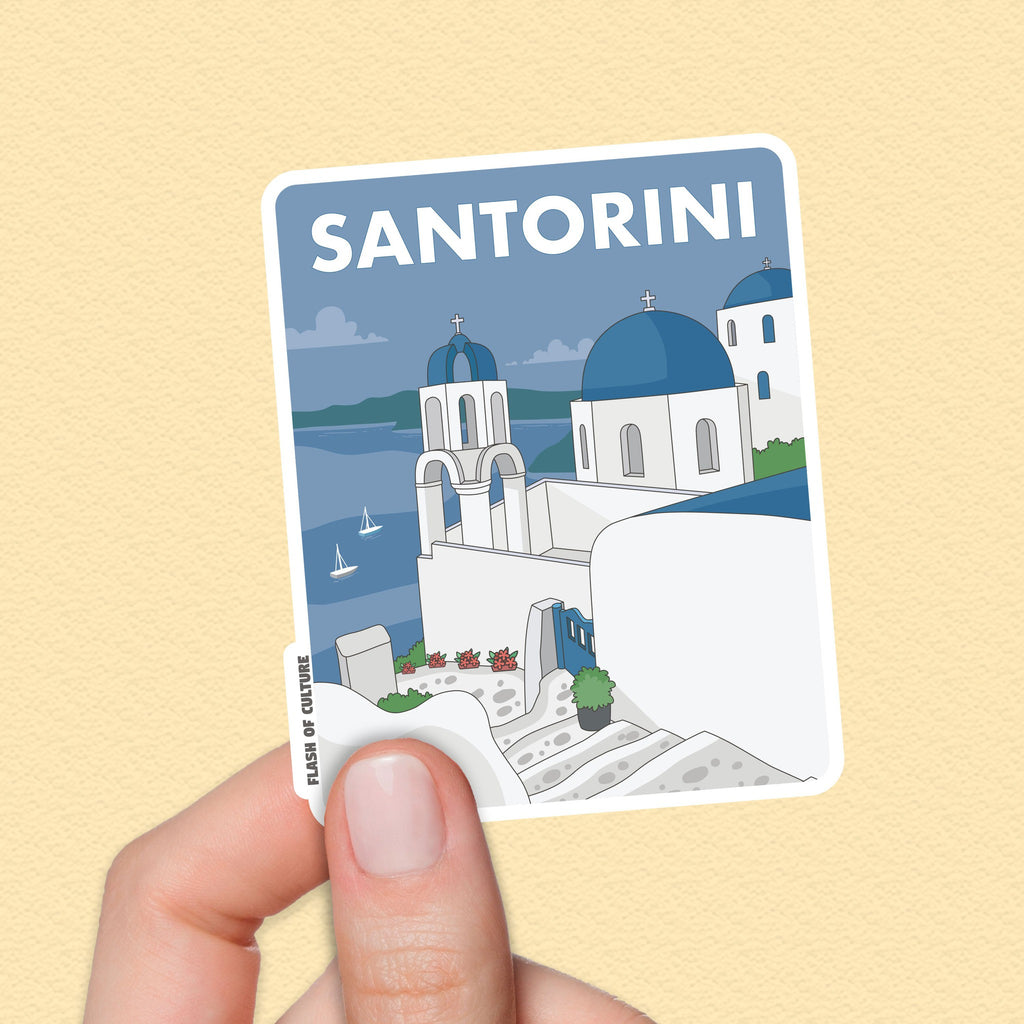 A high-quality vinyl sticker of the Greek Island of Santorini with the houses on a hill looking down over boats in the blue sea. The word Santorini is in large words across the top of the sticker—a lovely sticker souvenir of the Greek Islands.